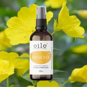 Olej z wiesiołka Oilo 100 ml wśród żółtych kwiatów wiesiołka