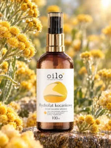 Hydrolat kocankowy 100 ml wśród kwiatów kocanki w słońcu