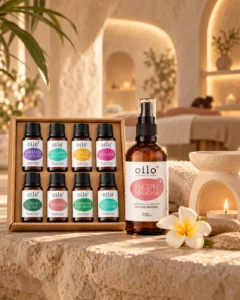 Aroma Power – zestaw olejków i olejek do masażu na kamiennym stoliku ze świecą
